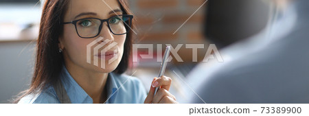 Woman speaking with colleague Woman speaking with colleague 73389900