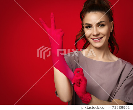 Young smiling pretty brunette woman doctor Young smiling pretty brunette woman doctor 73389901