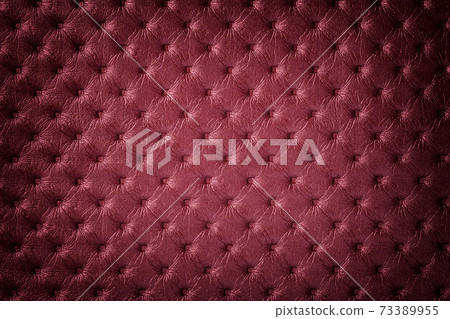 Texture of dark red leather background with capitone pattern with vignette. Texture of dark red leather background with capitone pattern with vignette. 73389955