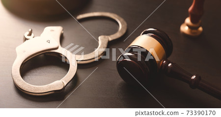 Crime and violence concept with handcuffs Crime and violence concept with handcuffs 73390170