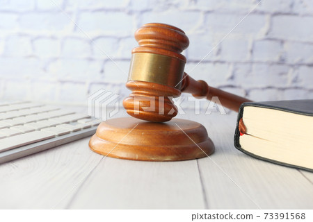 gavel and book with copy space on table gavel and book with copy space on table 73391568