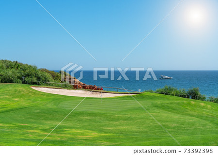 Resort luxury beaches, golf courses with palm trees, overlooking the sea for tourists to relax. Portugal algarve 73392398