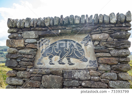FINTOWN , IRELAND - NOVEMBER 03 2020 : The stone monument is overlooking Lough Muck 73393799