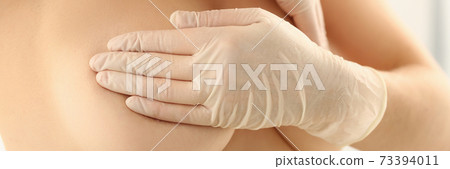 Topless woman doing breast check up with hands Topless woman doing breast check up with hands 73394011