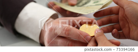 Businessman exchanging crypto currency for money at meeting Businessman exchanging crypto currency for money at meeting 73394166