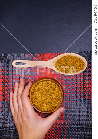 Fenugreek Seeds have medicinal properties close-up. selective focus. flat lay. copyspace. vertical photo 73394459