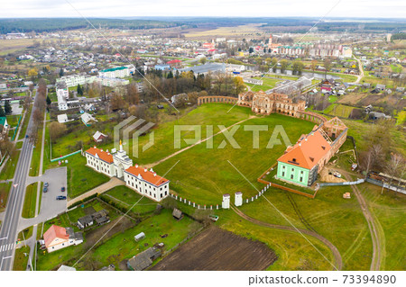 Ruzhansky Palace and the ruins of the facade of an abandoned ruined building of an ancient castle of the 18th century.Belarus Ruzhansky Palace and the ruins of the facade of an abandoned ruined building of an ancient castle of the 18th century.Belarus 73394890
