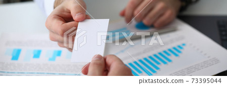 Businessman giving personal card to guest to office 73395044