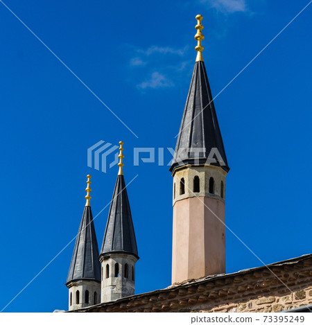 Abstract looking narrow pointed towers Abstract looking narrow pointed towers 73395249