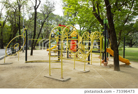 Playground in the park 73396473