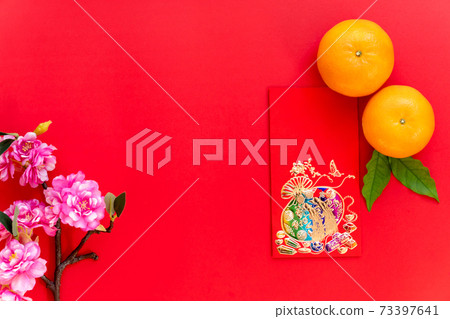 Red envelope put on red background, red envelope orange and blossom such as chinese new year, Red envelope put on red background, red envelope orange and blossom such as chinese new year, 73397641