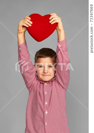 valentine's day. cute little child boy holding red heart 73397669