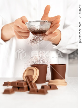 Young woman making chocolate dessert. Delicious food concept. Young woman making chocolate dessert. Delicious food concept. 73400293
