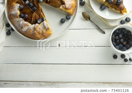 Galette , tart with pears and cinnamon filling. Baking background. 73401126