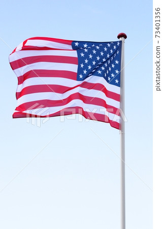 Flag of USA waving in the sky 73401356
