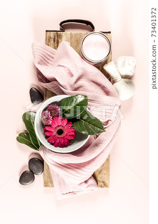 Spa setting on pink background. Flat lay Spa setting on pink background. Flat lay 73401372