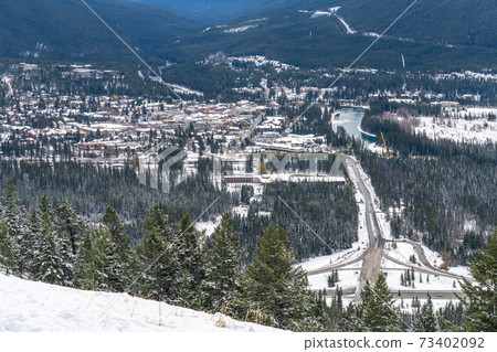 Overlook view Town of Banff in snowy winter season. View from Mount Norquay Banff View Point. Banff National Park, Canadian Rockies, Canada. Overlook view Town of Banff in snowy winter season. View from Mount Norquay Banff View Point. Banff National Park, Canadian Rockies, Canada. 73402092