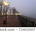 Fog on an empty river embankment 73403007