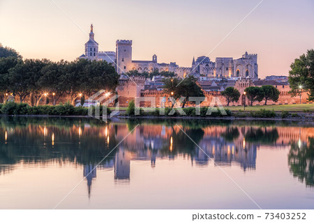 Avignon with Popes Palace during evening in Provence, France 73403252