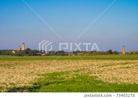 Beautiful view of famous Kap Arkona lighthouse in summer, island of Ruegen, Baltic Sea, Germany Beautiful view of famous Kap Arkona lighthouse in summer, island of Ruegen, Baltic Sea, Germany 73403278