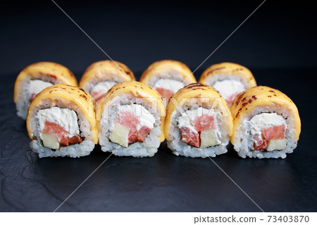 Spicy salmon and cheese grilled sushi rolls Spicy salmon and cheese grilled sushi rolls 73403870