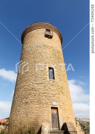 Tower in the village of Oingt in Beaujolais, France 73404198