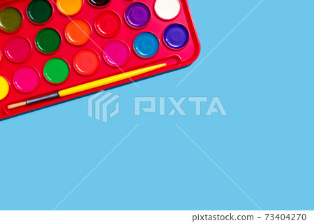 Watercolor paint with a brush Watercolor paint with a brush 73404270