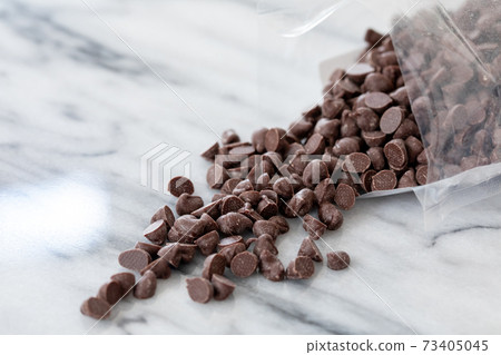 Chocolate chips taken out of the bag and studded with marble Chocolate chips taken out of the bag and studded with marble 73405045