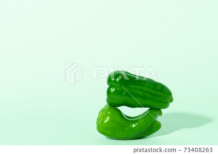 Multiple peppers white background 73408263