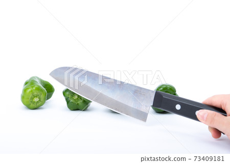Pepper kitchen knife cut white background Pepper kitchen knife cut white background 73409181