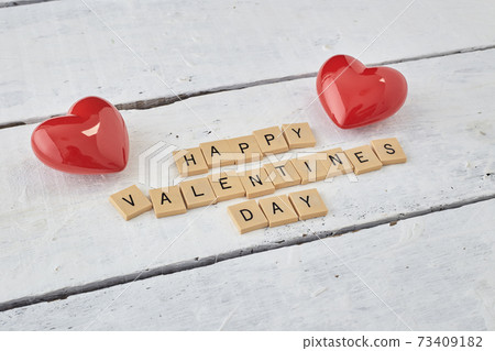 HAPPY Valentine's day text on white wood HAPPY Valentine's day text on white wood 73409182
