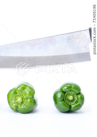 Pepper kitchen knife cut white background 73409196