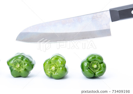 Pepper kitchen knife cut white background Pepper kitchen knife cut white background 73409198