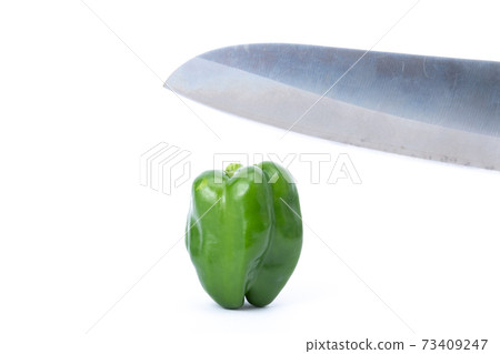 Pepper kitchen knife cut white background Pepper kitchen knife cut white background 73409247