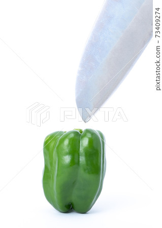 Pepper kitchen knife cut white background Pepper kitchen knife cut white background 73409274