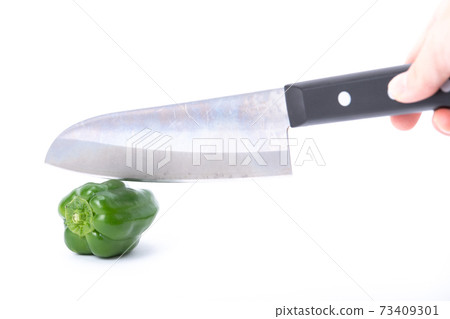 Pepper kitchen knife cut white background Pepper kitchen knife cut white background 73409301