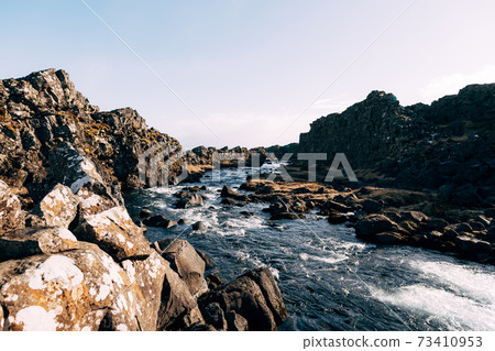 Mountain river from Ehsaraurfoss Falls, in Silfra Fault, Tingwedlir Valley. 73410953