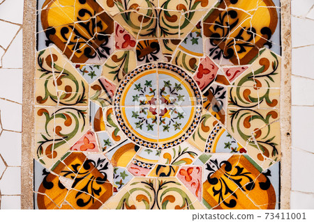 Close-up Mosaic Antonio Gaudi in the Park Guell, Barcelona 73411001