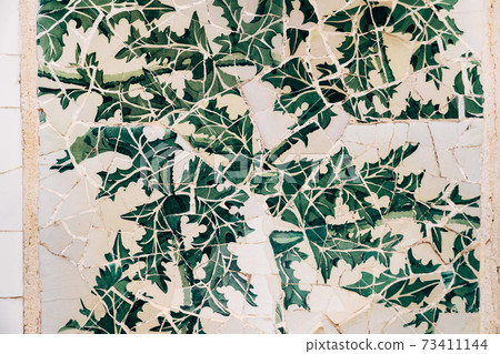 Close-up Mosaic Antonio Gaudi in the Park Guell, Barcelona 73411144