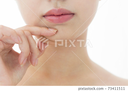 Woman pinching her chin Woman pinching her chin 73411511