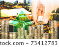 Exposure of Finance and Saving money banking concept,Hope of investor concept,Male hand putting money coin like stack growing business. background the city 73412783