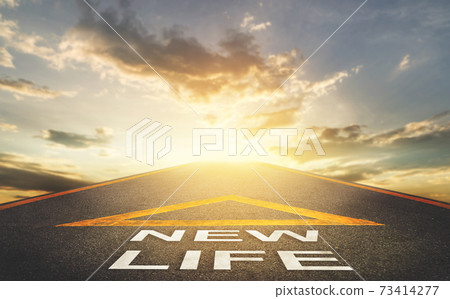 New life road signage leading to a bright golden sky for New begining concept. New life road signage leading to a bright golden sky for New begining concept. 73414277