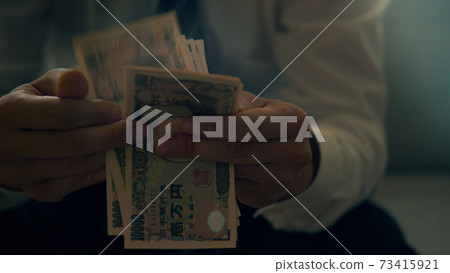 Male hand counting banknotes Male hand counting banknotes 73415921