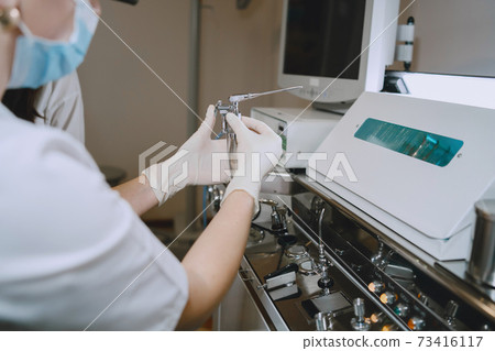 Doctor prepare to cleans tools of medical instruments 73416117