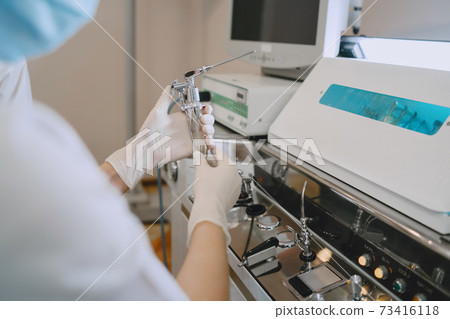 Doctor prepare to cleans tools of medical instruments 73416118