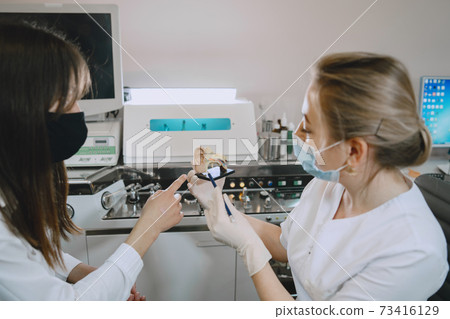 Otolaryngologist preparing for the medical examination procedure Otolaryngologist preparing for the medical examination procedure 73416129