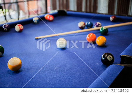 Billiard balls on the pool table  73418402