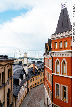 Picturesque cobblestoned street with colorful houses in Sodermalm in Stockholm 73418652
