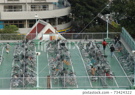 Bicycle parking lot in the morning Bicycle parking lot in the morning 73424322