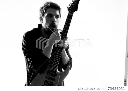 Musician with guitar rock star emotions entertainment modern performer 73425031